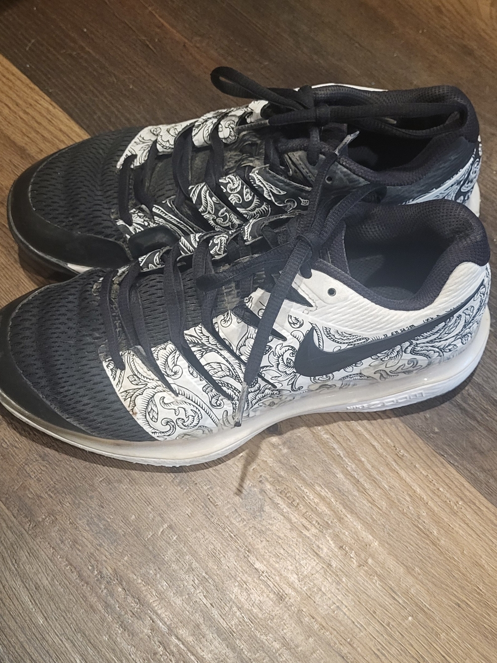 These are Nike Air Zoom Vapor X in the white/black "Rococo" Pattern.